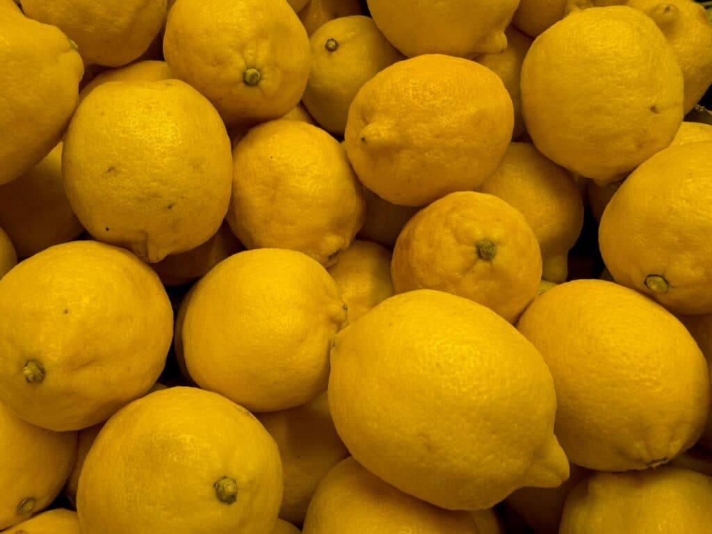 a pile of lemons sitting next to each other